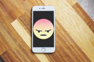 Outrage emoticon angry face on iPhone