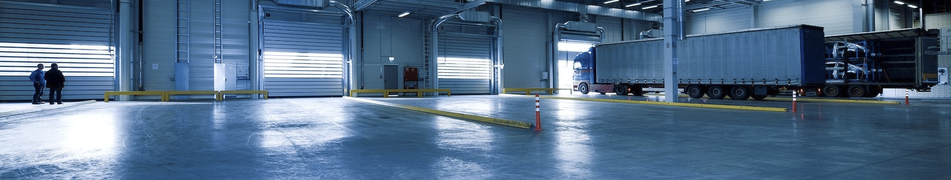 Empty distribution center with trucks ready to leave to illustrate concept of business continuity.